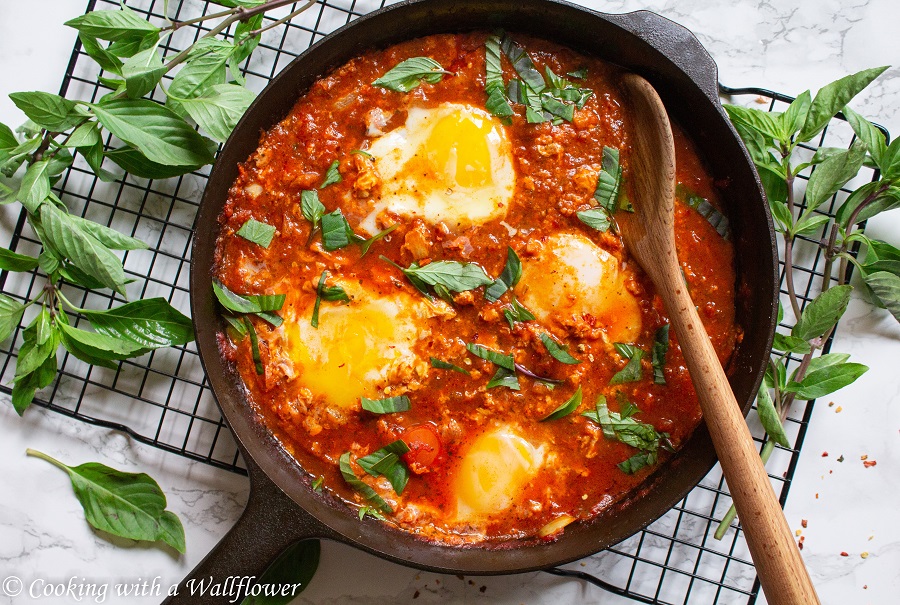 Spicy tomato based sauce, topped with eggs and basil. Eggs in Purgatory is easy to make, packed full of flavor, and perfect for a quick, and easy meal. | Ask Anna