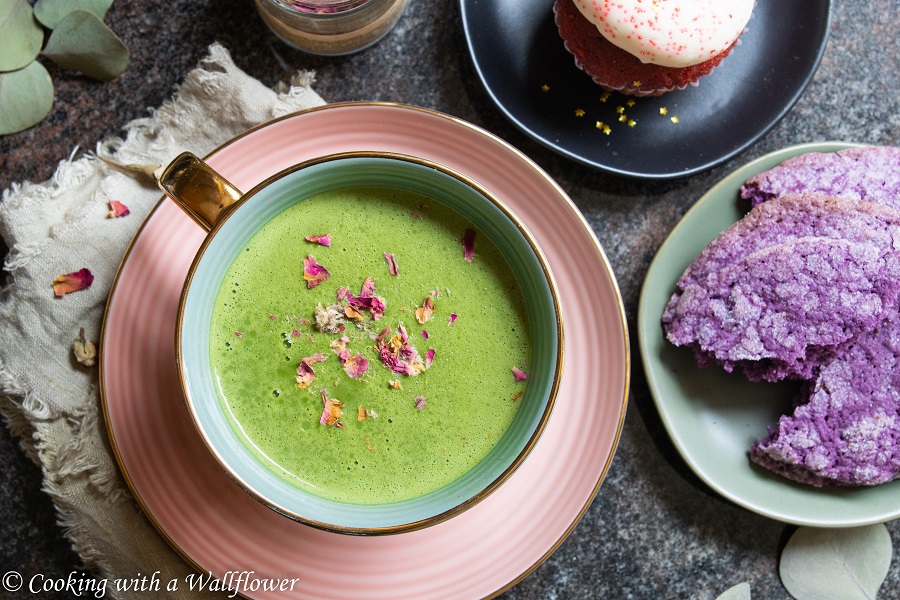 Creamy matcha latte sweetened with rose syrup and topped with dried rose buds. This matcha rose latte is simply delicious with a hint of rose. | Cooking with a Wallflower